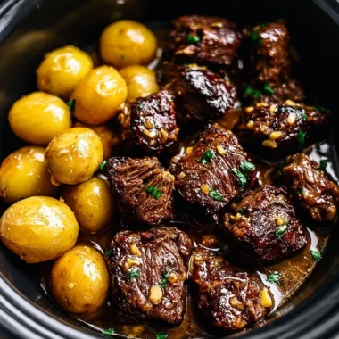 Delicious Garlic Butter Beef Bites served with potatoes in a savory dish