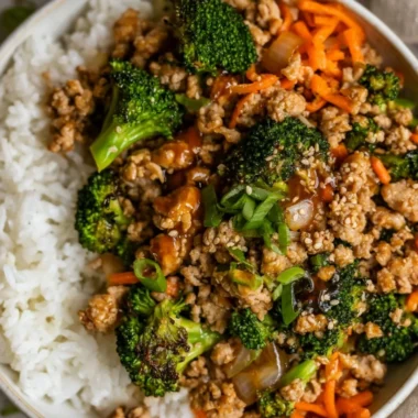 Ground turkey teriyaki stir fry with vegetables and rice in a bowl.
