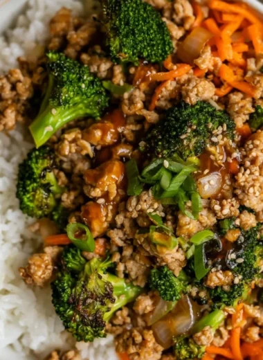 Ground turkey teriyaki stir fry with vegetables and rice in a bowl.
