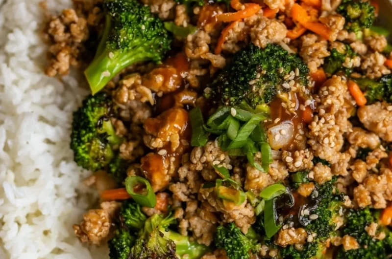 Ground turkey teriyaki stir fry with vegetables and rice in a bowl.