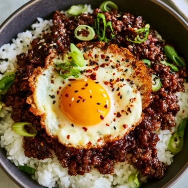 Delicious Korean Ground Beef Bowl topped with fresh vegetables and sauce
