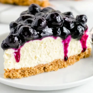 No Bake Blueberry Cheesecake topped with fresh blueberries