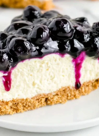 No Bake Blueberry Cheesecake topped with fresh blueberries