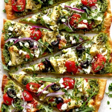 Delicious Mediterranean Flatbread Pizza topped with fresh vegetables and herbs