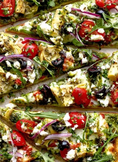 Delicious Mediterranean Flatbread Pizza topped with fresh vegetables and herbs
