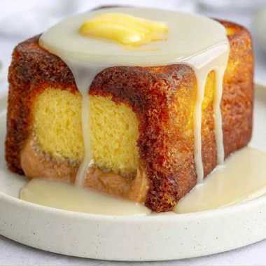 Hong Kong Style French Toast served with syrup and butter on a plate.