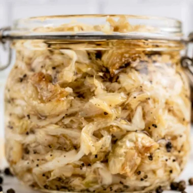 Delicious roasted garlic sauerkraut served in a bowl, showcasing its texture and color