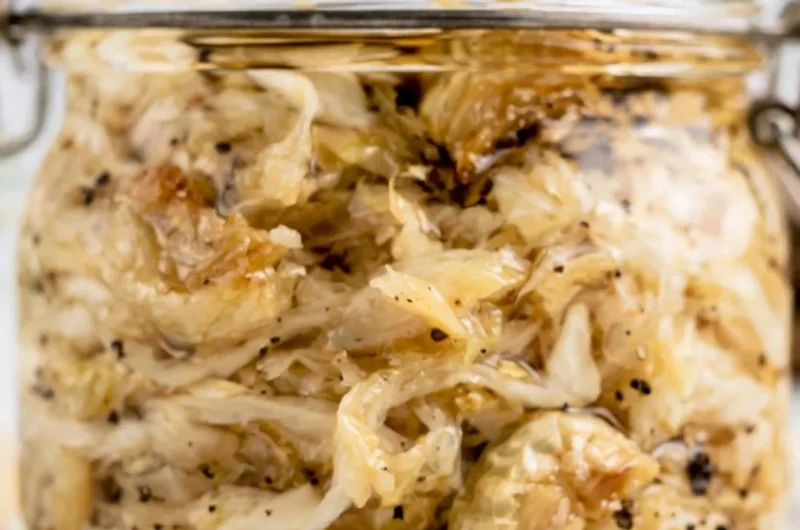 Delicious roasted garlic sauerkraut served in a bowl, showcasing its texture and color
