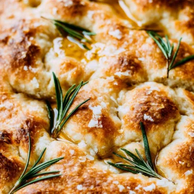 Freshly baked same day sourdough focaccia bread with herbs and olive oil