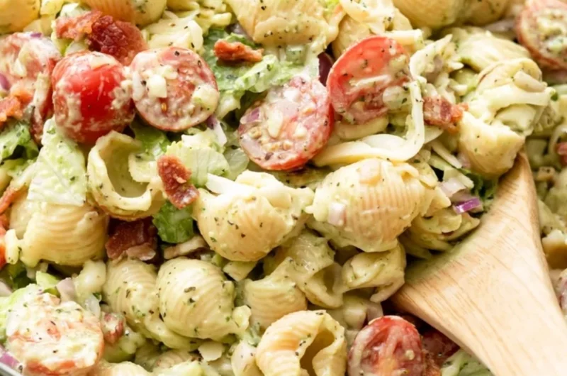 A vibrant bowl of BLT Pasta Salad with bacon, lettuce, and tomatoes.