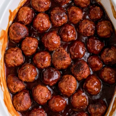 Three-ingredient grape jelly meatballs on a serving platter
